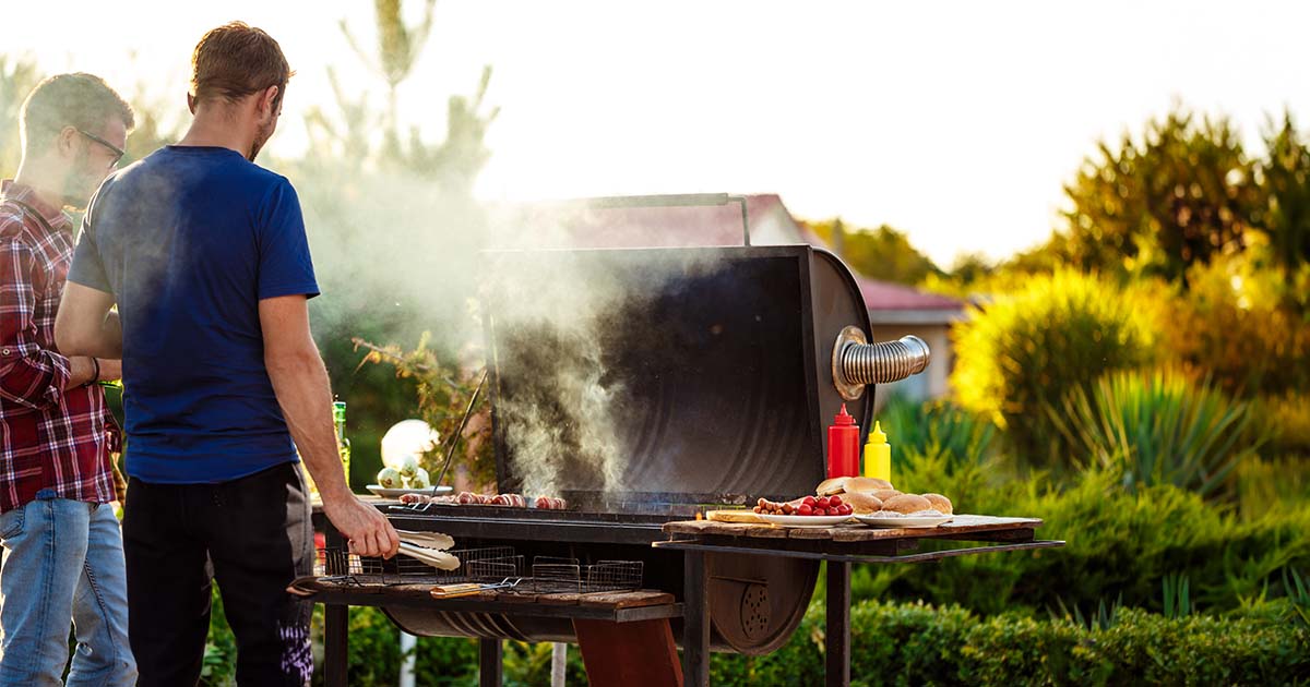 man grilling outside