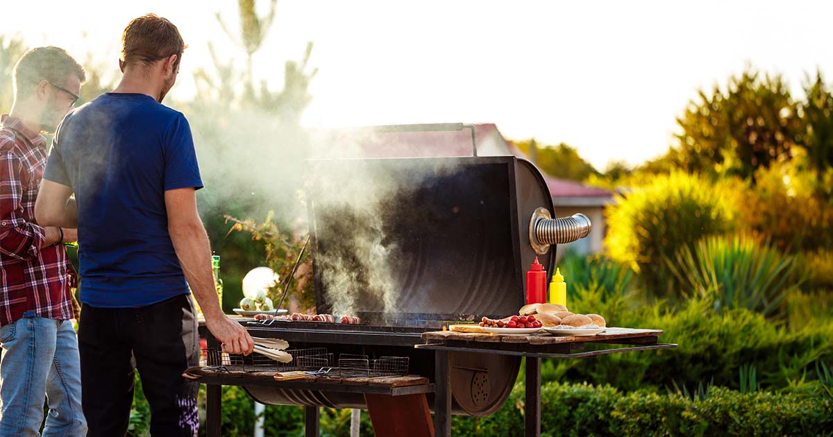 man grilling outside