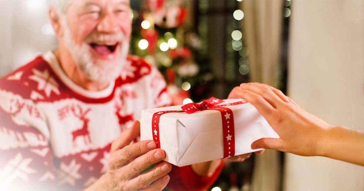 Elderly man receiving a gift