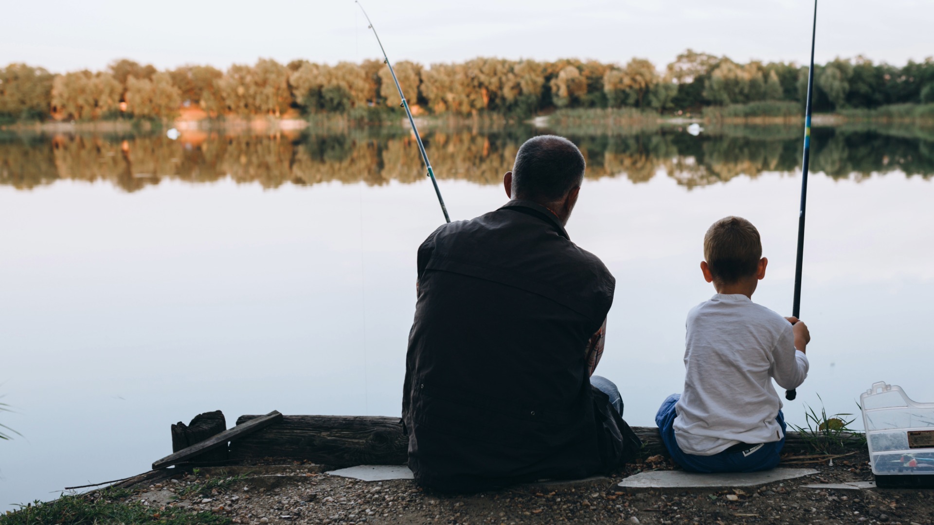 son and father fishing