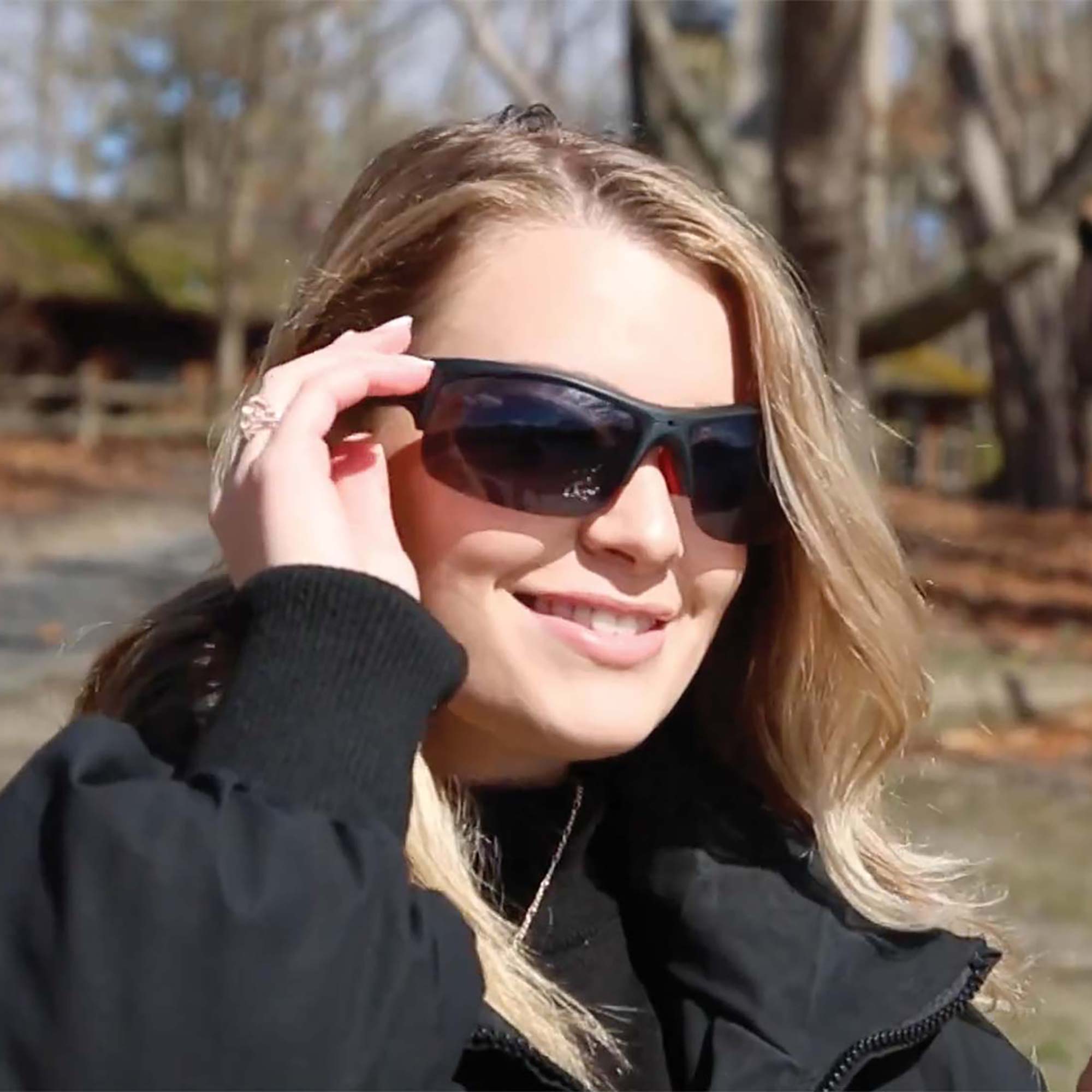 woman wearing recording sunglasses